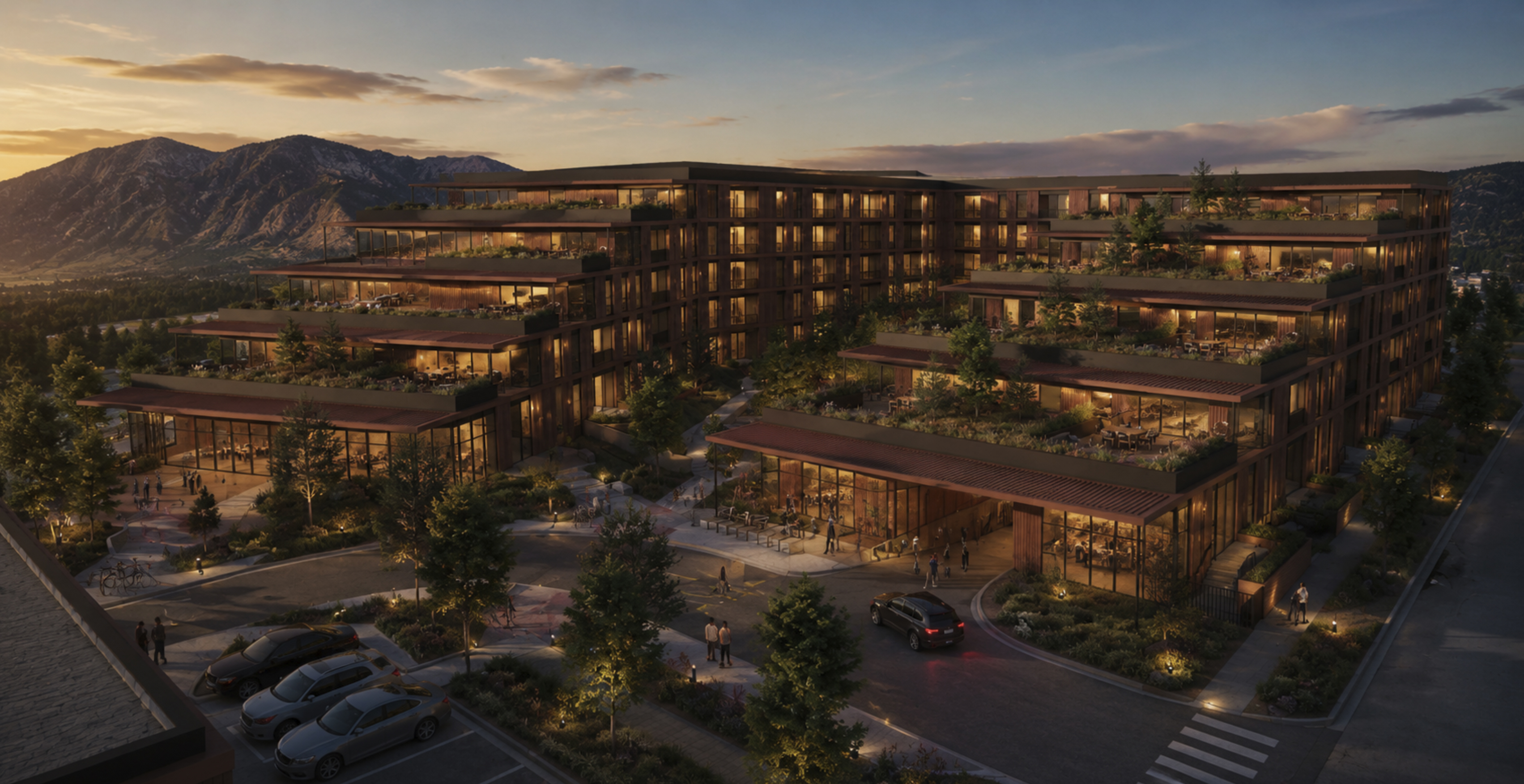 Aerial dusk rendering of a Boulder Development Group terraced multifamily community with landscaped green-roof terraces, an active ground-level plaza, and the Flatirons at sunset